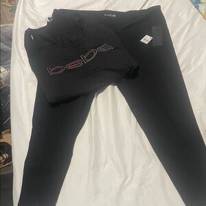Bebe Black Leggings 3/4 length with pockets on sides